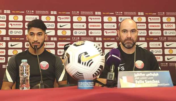 Qatar coach Felix Sanchez (right) and midfielder Mohamed Waad at a press conference yesterday.