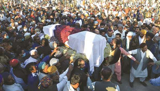 Officials and residents carry the coffin of former prime minister Mir Zafarullah Khan Jamali  during his funeral at his ancestral town of Rojhan Jamali in Balochistan.