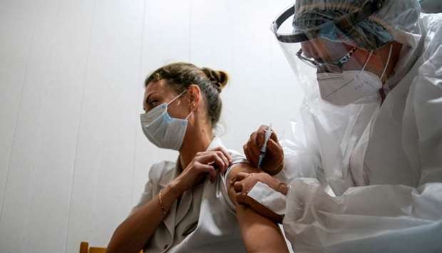 A medic of the regional hospital receives Russia's ,Sputnik-V, vaccine shot against the coronavirus disease in Tver, Russia October 12.