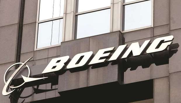 The Boeing signage is displayed on its building in Chicago. Boeingu2019s debt totalled around $60bn as of the end of September, more than double its level at the end of last year and four times the amount at the end of 2018.