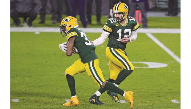 In this November 29, 2020, picture, Aaron Rodgers (right) of the Green Bay Packers hands the ball to Aaron Jones during a game against the Chicago Bears at Lambeau Field in Green Bay, Wisconsin, United States. The Philadelphia Eagles are in a desperate situation heading into their week 13 game against the Green Bay Packers, but coach Doug Pederson says heu2019s not about to start pointing fingers. (AFP)