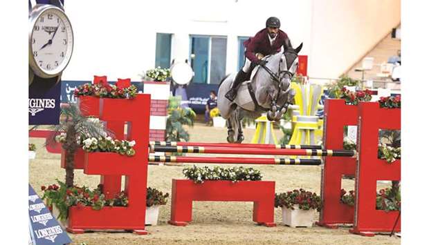 Jaber Rashid al-Amri astride 12-year-old grey stallion Canavaro De Muze (ET) in action during the fifth round of the Longines Qatar Equestrian Tour Hathab supported by The Social & Sport Contribution Fund at Qatar Equestrian Federationu2019s indoor arena yesterday.