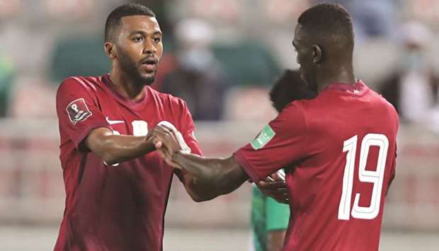 Qataru2019s Abdelaziz Hatem (left) and Almoez Ali celebrate a goal during the AFC Asian Cup China 2023 qualification match against Bangladesh at Abdullah Bin Khalifa Stadium yesterday. (Twitter/QFA)