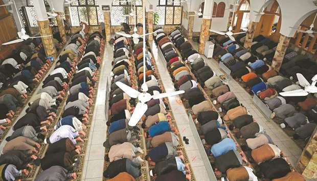 Muslims offer weekly Friday prayers at a mosque in Islamabad yesterday. The government has announced a u2018Day of Prayeru2019 for the coronavirus pandemic.
