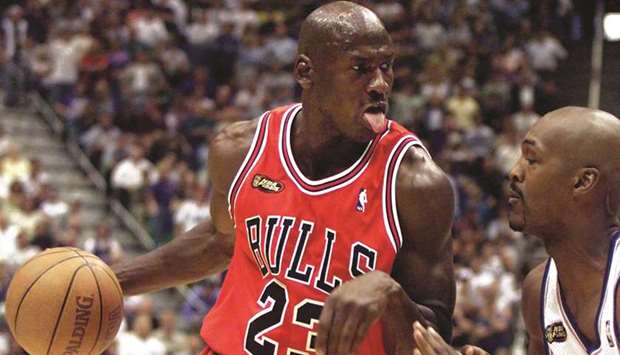 In this June 5, 1998, picture, Chicago Bulls guard Michael Jordan (left) drives to the hoop against the Utah Jazzu2019s  Brian Russell during the first half of Game 2 of the NBA Finals in Salt lake City. (Reuters)
