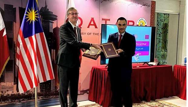 HE the Ambassador of Qatar to Malaysia Fahad bin Mohammed Kafoud (R) and UNHCR Representative Thomas Albrecht during a ceremony of providing connectivity and online learning tools such as tablets to refugee students