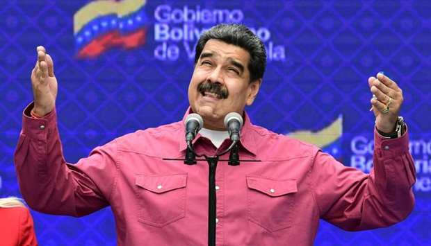 Venezuelan President Nicolas Maduro gestures while delivering a press conference at a polling station in the Simon Rodriguez school in Fuerte Tiuna, Caracas, on December 6 during Venezuela's legislative elections