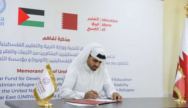 HE Khalifa bin Jassim Al-Kuwari, Director General of QFFD, signing the MoU