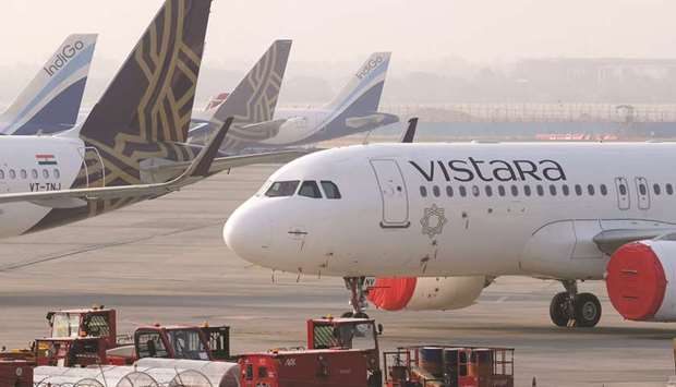 Grounded aircraft stand at Terminal 3 at the Indira Gandhi International Airport during a lockdown implemented due to the coronavirus in New Delhi. Tata Groupu2019s two airlines u2013 AirAsia India and Vistara u2013 were struggling before the coronavirus  pandemic. Covid-19 has put the sprawling Tata Sons, which owns a 51% stake in each, at a crossroads.