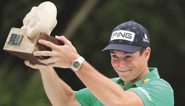 Viktor Hovland celebrates after winning Mayakoba Classic in Playa del Carmen, Mexico. (AFP)