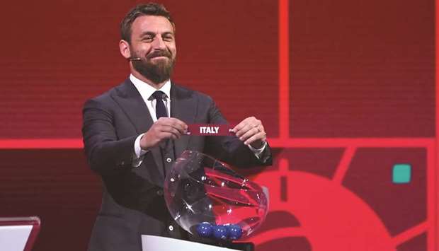 Former Italian player Daniele De Rossi holds the slip of Italy during the UEFA preliminary draw for the FIFA Qatar World Cup 2022 yesterday in Zurich. (AFP)