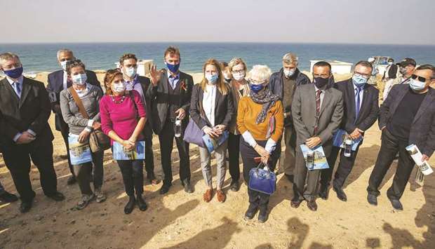 Sven Kuhn von Burgsdorff (sixth left), head of the European Unionu2019s mission to the West Bank and Gaza Strip, poses for a souvenir photo with other EU representatives during a visit to a desalination plant in Deir al-Balah in the central Gaza Strip, yesterday.