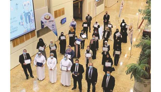 STEM teachers show their certificates after completing the training at CNA-Q.