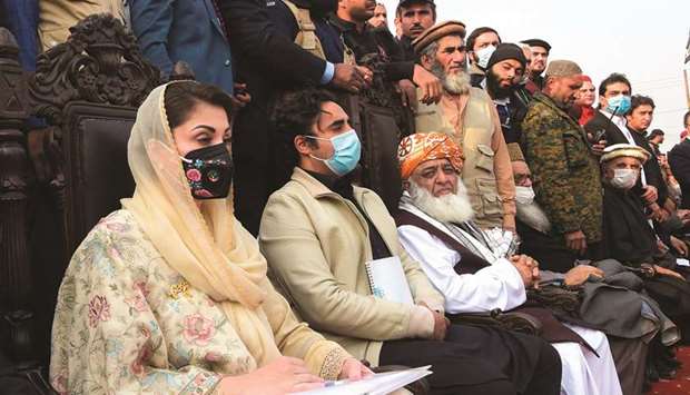 Leaders of the Pakistan Democratic Movement (PDM) seated from left: PML-N Vice-President Maryam Nawaz, PPP Chairman Bilawal Bhutto-Zardari and PDM chief Maulana Fazlur Rehman during a political rally in Peshawar last month. (File photo)