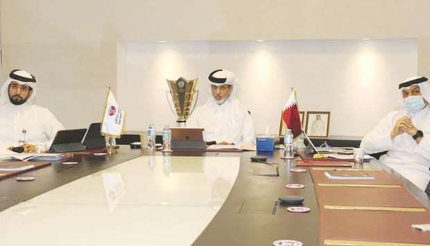 Qatar Football Association (QFA) president Sheikh Hamad bin Khalifa bin Ahmed al-Thani (centre), QFA Executive Committee member Hani Ballan (right) and Secretary General Mansour al-Ansari attend AFC Congressu2019 virtual meeting yesterday.
