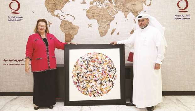 Ambassador Greta Holtz with Qatar Charity CEO Yousef bin Ahmed al-Kuwari.