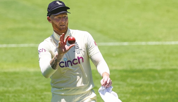 Englandu2019s Ben Stokes shines the ball during day two of the first Ashes Test against Australia at the Gabba in Brisbane yesterday.