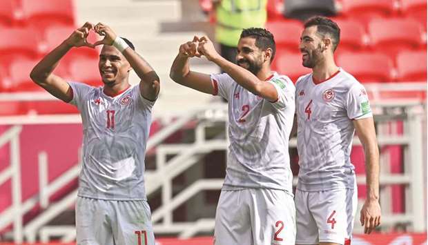 Seifeddine Jaziri (left) celebrates with teammates after scoring a goal against Mauritiana in the FIFA Arab Cup match at the Ahmad Bin Ali Stadium. on Tuesday. PICTURES: Noushad Thekkayil