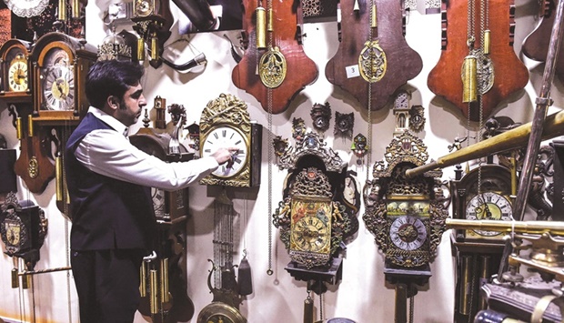 In this picture taken on November 26, collector Gul Kakar shows his antique clocks at a museum in Quetta.