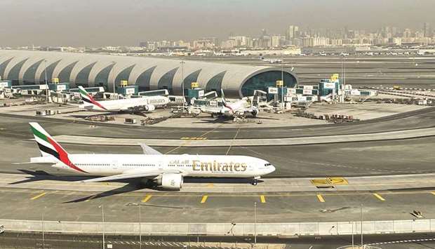 Emirates airliners are seen on the tarmac in a general view of Dubai International Airport. The airline posted a loss of 5.8bn dirham ($1.6bn) for the April-September period, down from a 12.6bn dirham loss for the same period last year.