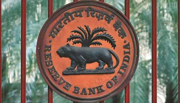 The RBI logo is seen at the gate of its office in New Delhi. A possible tightening of monetary policy by the Federal Reserve may not prompt the Reserve Bank of India to follow suit as inflationary pressures are contained for now, a top government adviser said.