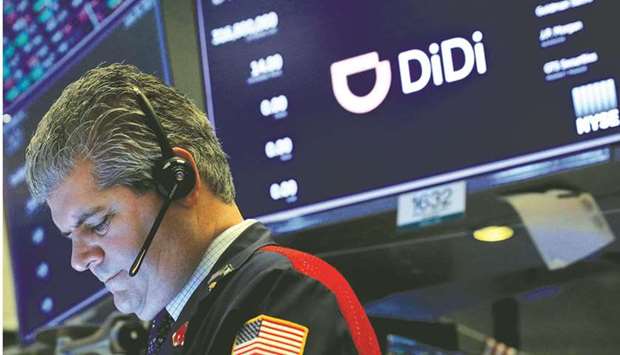 A trader works during the IPO for Chinese ride-hailing company Didi Global on the New York Stock Exchange floor on June 30. The overhaul would represent one of Beijingu2019s biggest steps to crack down on overseas listings following the New York IPO of Didi, which proceeded despite regulatory concerns.