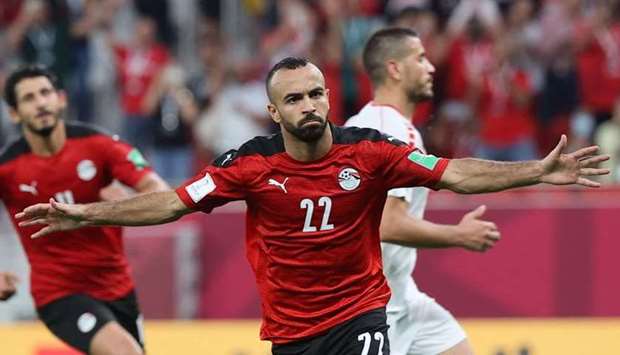 Egypt's midfielder Mohamed Magdy celebrates after scoring the first goal during the FIFA Arab Cup 2021 group D football match between Egypt and Lebanon at the Al-Thumama Stadium in Doha. AFP
