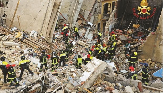 This handout picture released by Italian Firefighters (Vigili del Fuoco) shows firefighters working after a four-storey apartment building collapsed, following a gas explosion, in Ravanusa yesterday. (AFP)