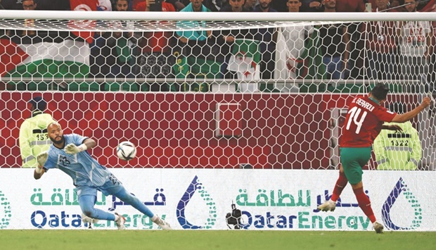 Algeriau2019s goalkeeper Rais Mbolhi dives to save a penalty from Moroccou2019s Karim El Berkaoui during the FIFA Arab Cup quarter-final at Al Thumama Stadium yesterday. PICTURES: Noushad Thekkayil
