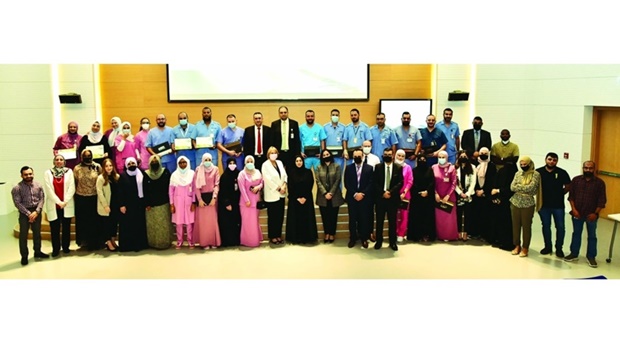 The graduates and officials at the ceremony.