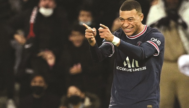 PSG forward Kylian Mbappe celebrates after scoring a goal against AS Monaco during the Ligue 1 match in Paris on Sunday. (AFP)