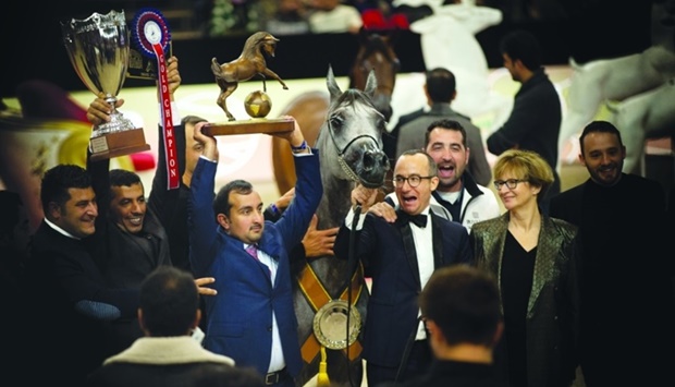 Connections of Siwar Al Shaqab celebrate after the filly won at the 2021 Arabian Horse World Championship in Paris.