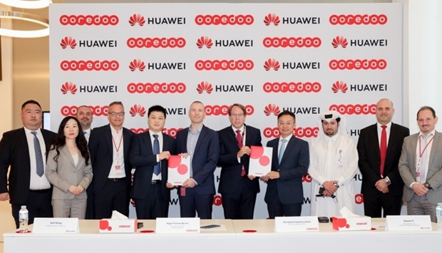 Officials and dignitaries from Ooredoo Group and Huawei after the signing ceremony
