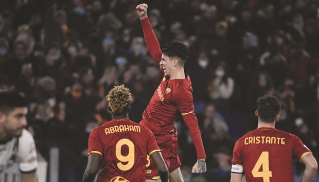 Romau2019s Brazilian defender Roger Ibanez celebrates after scoring his sideu2019s second goal during the Italian Serie A match against Spezia at the Olympic Stadium in Rome. (AFP)