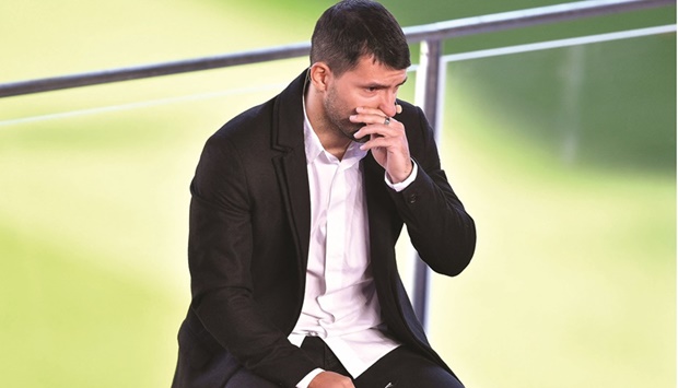 Barcelonau2019s Argentinian forward Sergio Aguero reacts as he addresses a press conference to announce his retirement from football at the Camp Nou Stadium in Barcelona yesterday. (AFP)