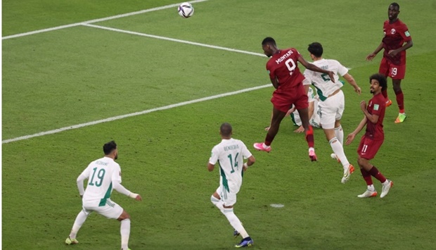 Qatar's Mohammed Muntari scores the team's first goal in the FIFA Arab Cup Semi Final match against Algeria at the Al Thumama Stadium, Doha,Wednesday. Algeria won 2-1 , setting up a final with Tunisia on Saturday