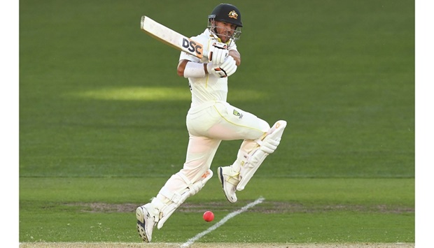 Australiau2019s David Warner plays a shot on the day one of the second Ashes Test against England in Adelaide yesterday. (AFP)