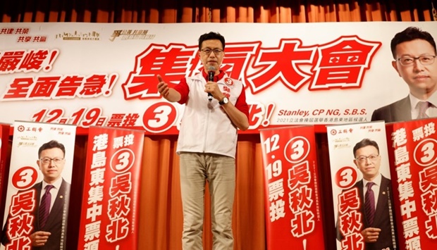Trade Unions (HKFTU) candidate Stanley Ng Chau-pei shots slogans during a camping rally, before Legislative Council election, in Hong Kong, China December 11, 2021