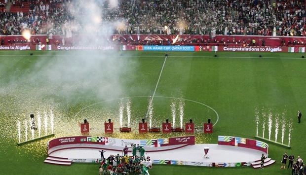 Algeria players celebrate with trophy after winning the final match at Al Bayt Stadium. REUTERS