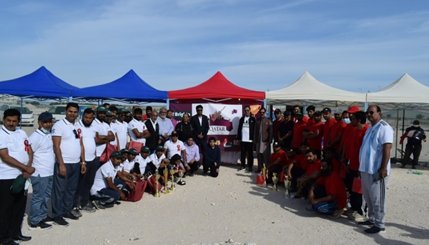 Organisers and participants pose for a group photo.