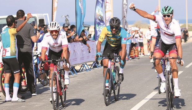 Mouhcine Rhaili (right) celebrates after winning the 'A' race at the Dukhan North road race.