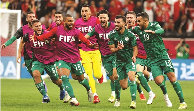 Algeriau2019s Amir Sayoud (second right) celebrates with teammates after scoring against Tunisia during the FIFA Arab Cup 2021 final at Al Bayt stadium in Al Khor on Saturday. (AFP)