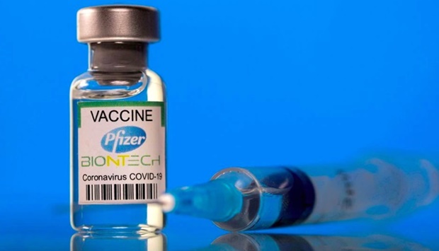 A vial labelled with the Pfizer-BioNTech coronavirus disease (Covid-19) vaccine is seen in this illustration picture taken March 19, 2021.