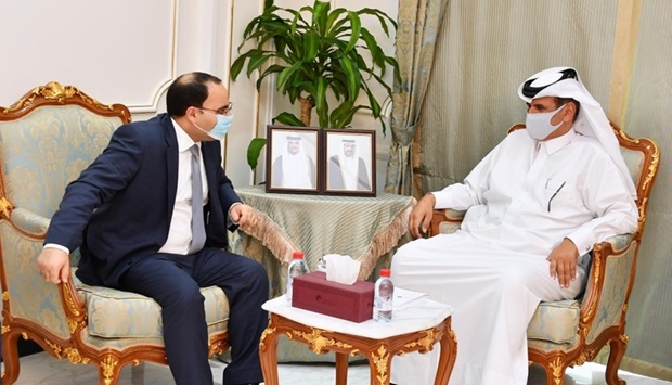 Qatar Chamber first vice-chairman Mohamed bin Towar al-Kuwari in a huddle with Maltau2019s Minister for Finance and Employment, Clyde Caruana, during a meeting held in Doha Monday