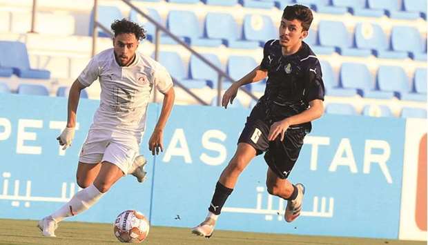 Al Gharafa and Al Arabi players vie for the ball during the Ooredoo Cup at the Al Wakrah Stadium on Thursday.