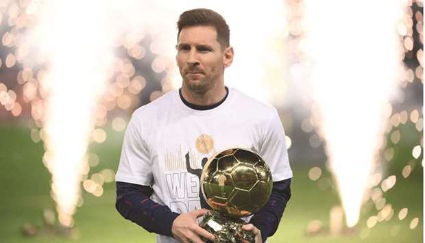 Paris Saint-Germainu2019s Lionel Messi presents his Ballon du2019Or award prior to the French L1 match against Nice at The Parc des Princes Stadium in Paris yesterday. (AFP)