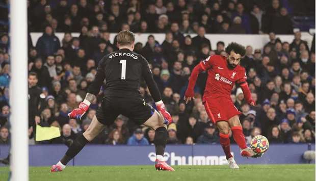 Liverpoolu2019s Mohamed Salah scores their second goal against Everton during their Premier League match in Liverpool. (Reuters)