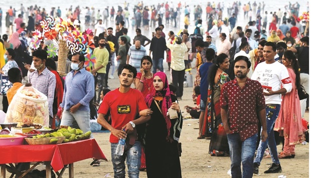 People visit Juhu beach despite the Covid pandemic, in Mumbai, India, yesterday.