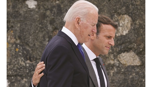 File photo: US President Joe Biden speaks with French President Emmanuel Macron after posing for the family photo with guests at the G7 summit, in Carbis Bay, Britain, on June 11, 2021.