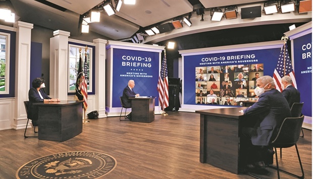 Biden and his Covid-19 Response Team (Covid-19 Response co-ordinator Jeff Zients, Centres for Disease Control and Prevention [CDC] director Dr Rochelle Walensky, and White House Chief Medical Adviser Dr Anthony Fauci) hold their regular call with the National Governors Association to discuss his administrationu2019s response to the Omicron variant and to hear from the governors on the needs in their states, in the South Court Auditorium at the White House.